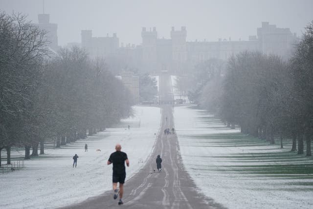 <p>A snowy scene looking along the Long Walk towards Windsor Castle, Berkshire, as parts of the UK wake up to snow and a yellow weather warning</p>